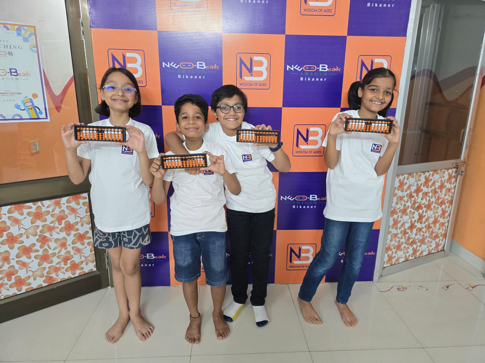 Happy Indian children learning with colorful abacus beads